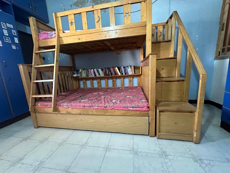 Used wooden bunker bed with a third sliding bed under. 4