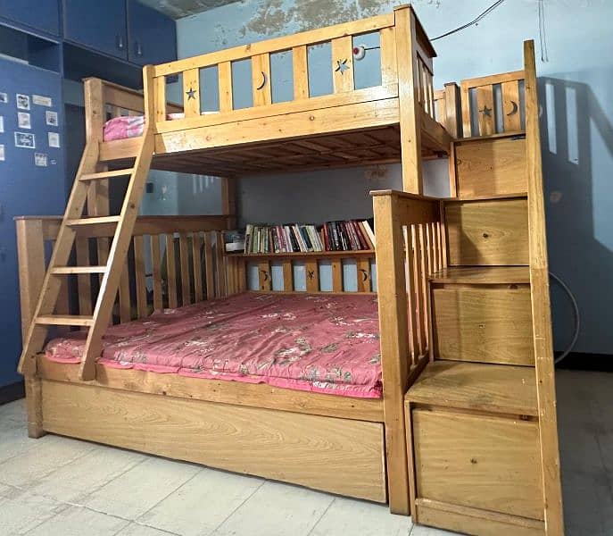 Used wooden bunker bed with a third sliding bed under. 5