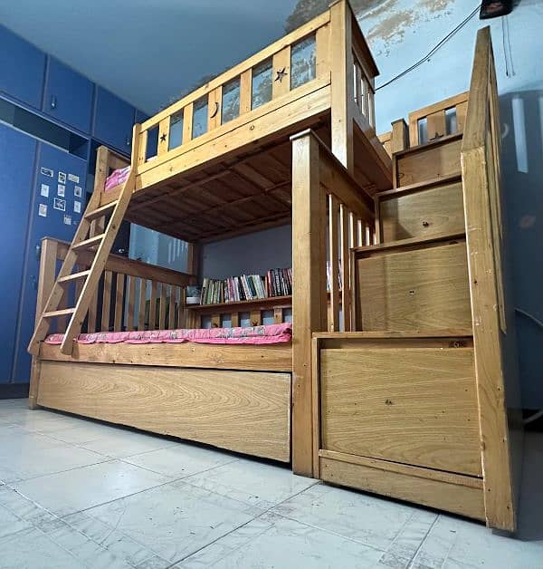 Used wooden bunker bed with a third sliding bed under. 6