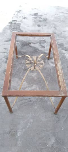 rot iron table frames and glass