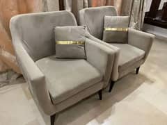 2 sofa type chairs with cushions