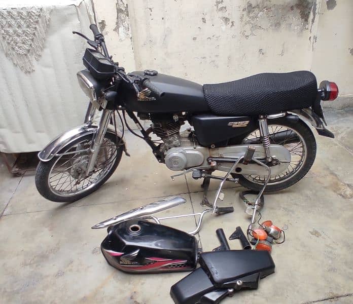 Honda GG125 with extra Saman 1