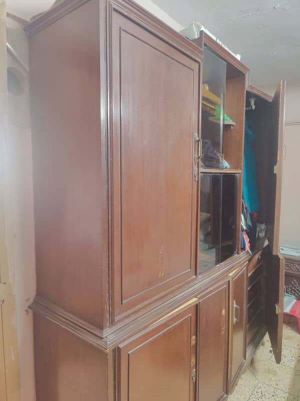 selling this used cupboard few doors need to be fixed 2