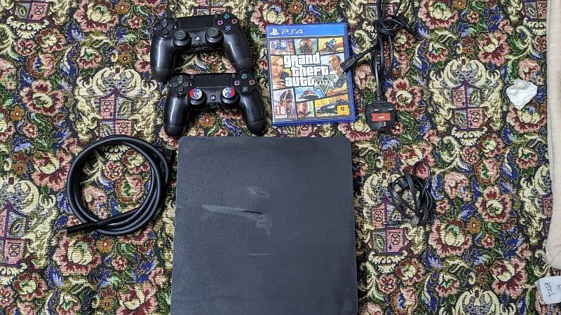 ps4 slim 500gb with 2 controllers and GTA 5 0