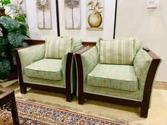 5 seater sofa set with wooden table and carpet