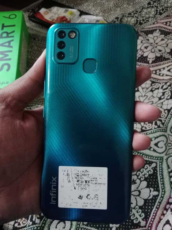 Infinix smart6 with box and charger 4