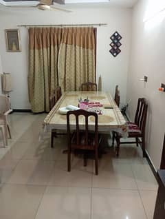 well maintained dinning table with set of eight chairs