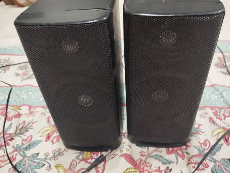 2 Speakers . . . 1