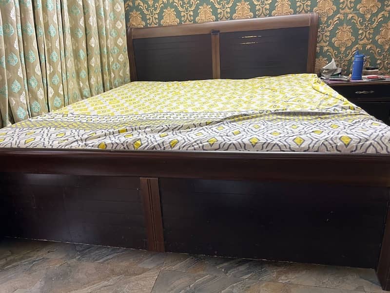 Double bed with side table and sprigs mattress 3