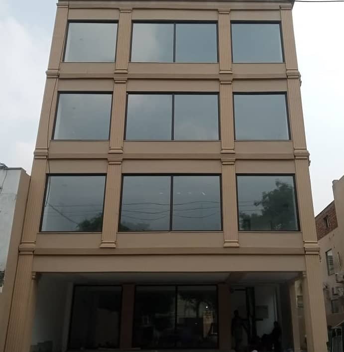 One kanal Brand New Commercial Paid Plaza available for rent in Garden Town Lahore 0