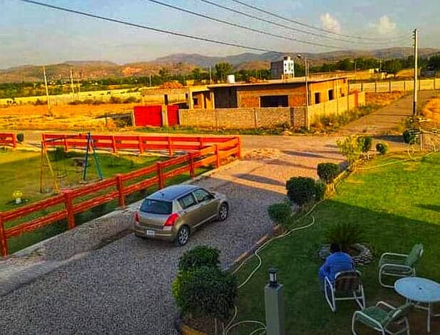 Taxila garden lavel position plot park face for sale 15