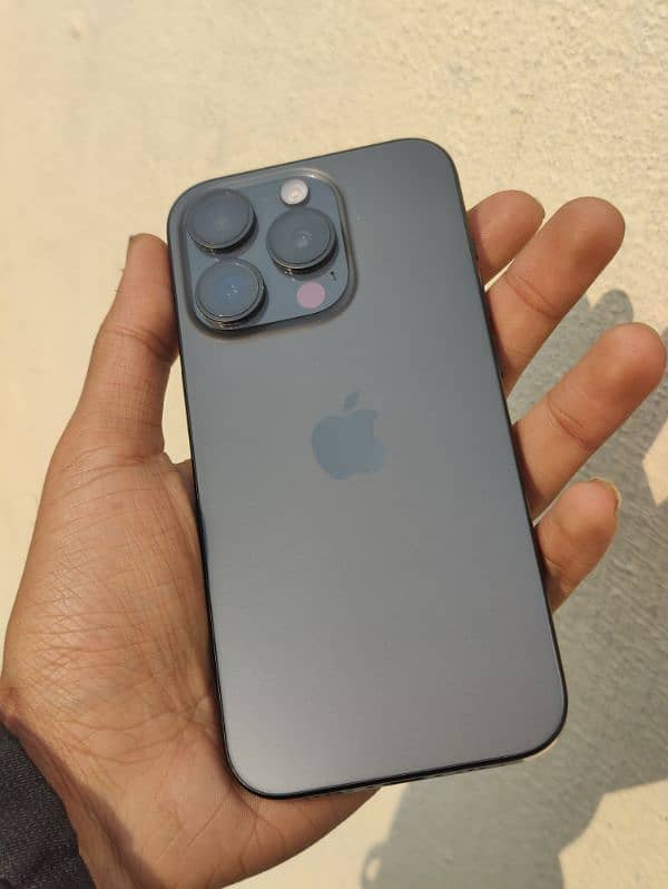 IPhone 15 pro with accessories and AirPods 0