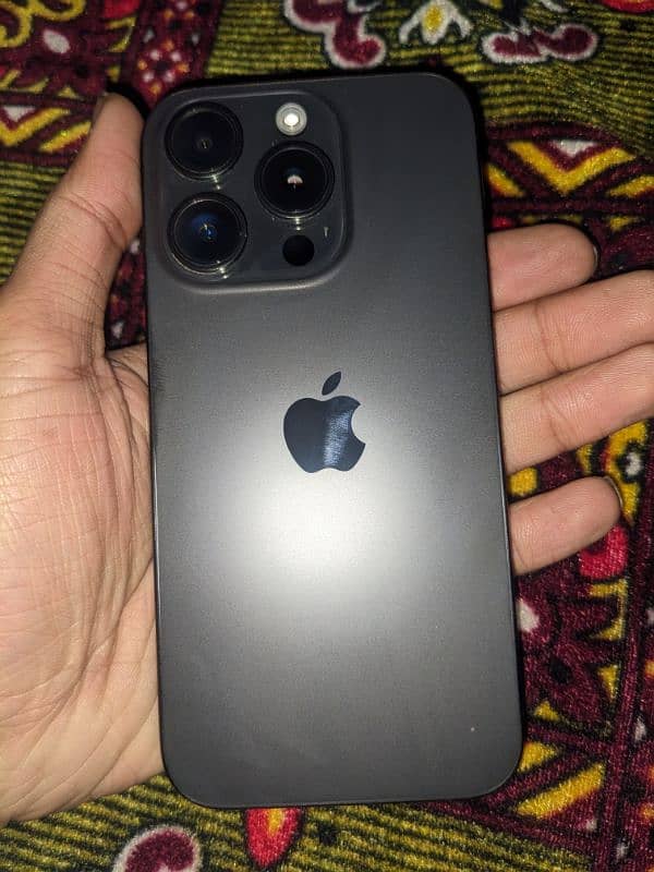 IPhone 15 pro with accessories and AirPods 1