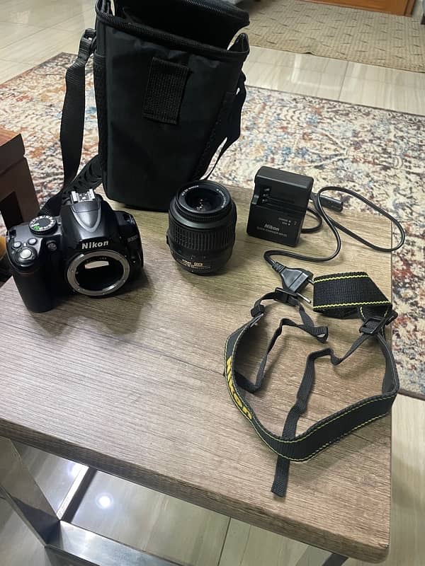 Nikon D3000 + 18-55mm Lens + charger + Bag 1