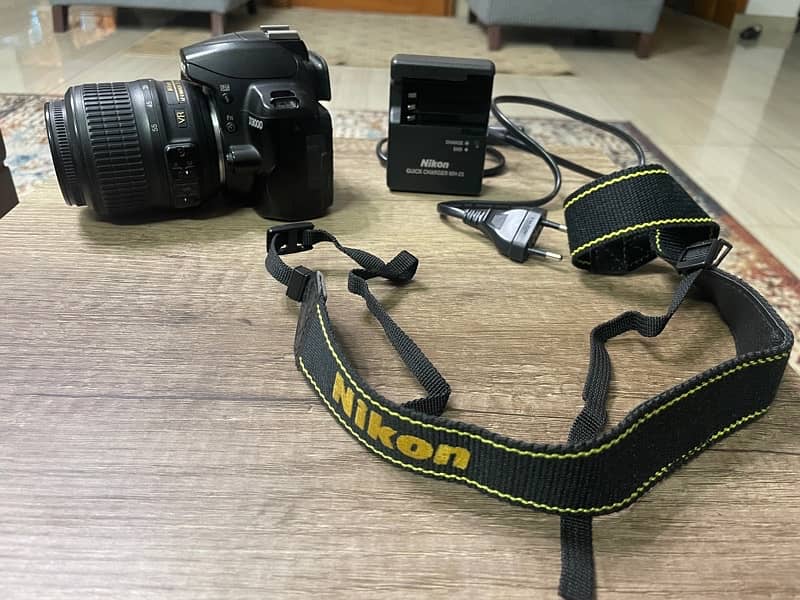 Nikon D3000 + 18-55mm Lens + charger + Bag 7