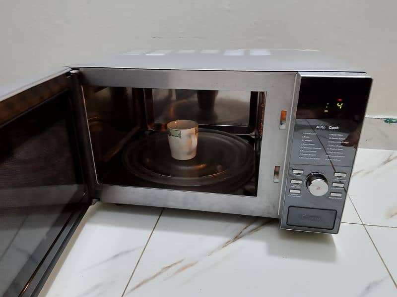 Dawlance 3 in 1 steel body microwave oven 3 days checking warranty 0