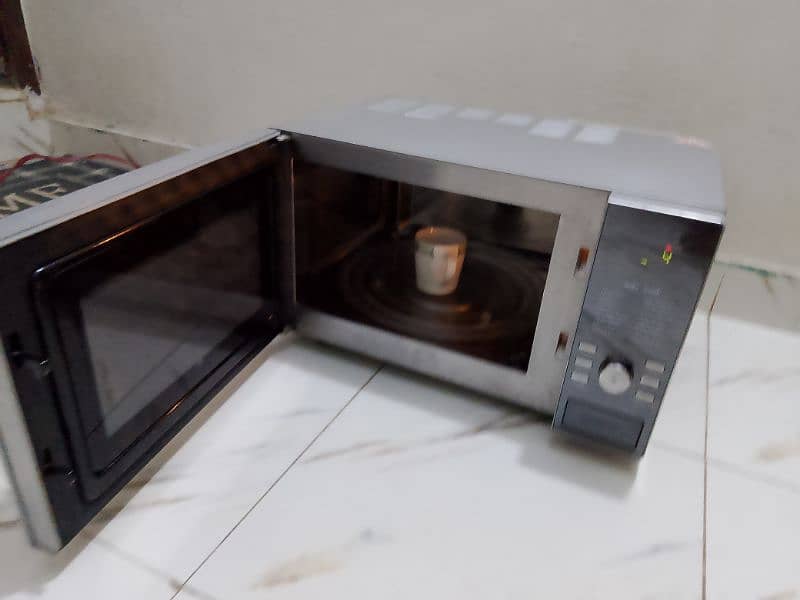 Dawlance 3 in 1 steel body microwave oven 3 days checking warranty 7