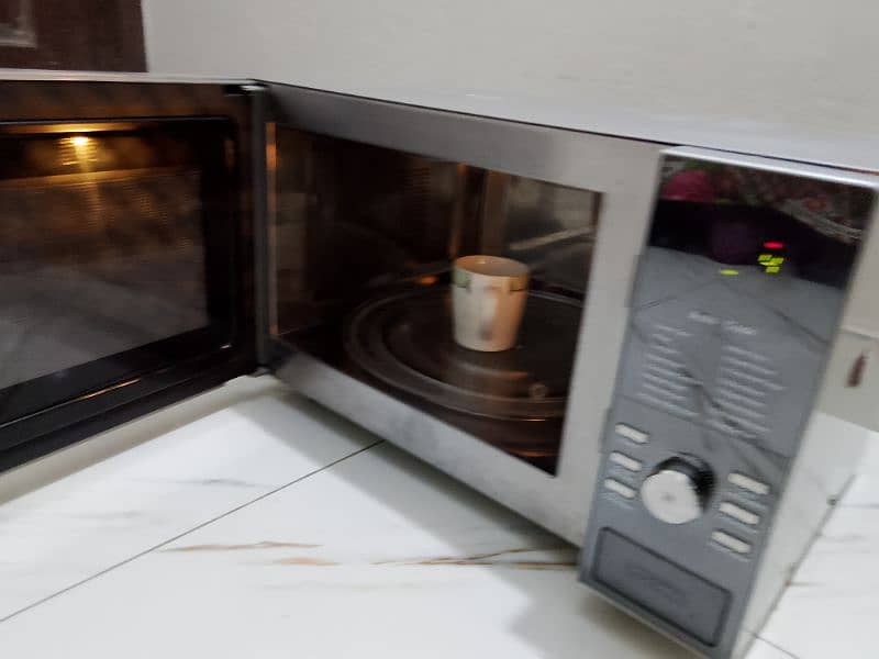 Dawlance 3 in 1 steel body microwave oven 3 days checking warranty 8