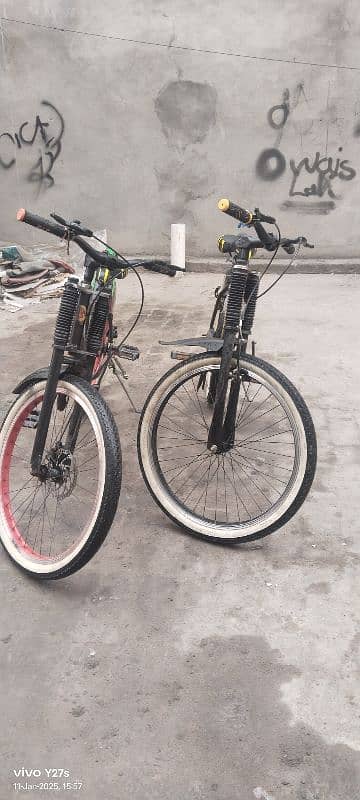 non gear cycles ek one has two disc breaks and one has 2 power breaks 2