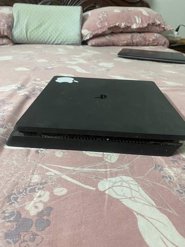 ps4 slim 1 TB with 2 original controllers 2 original games 0