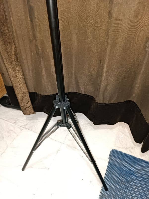 ring light with a tripod stand. 6