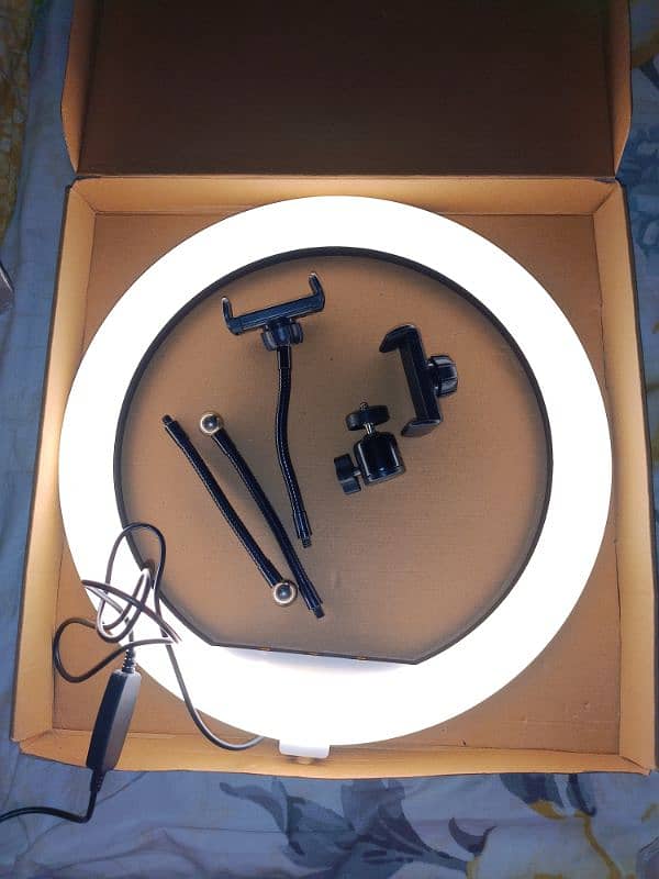 ring light with a tripod stand. 9