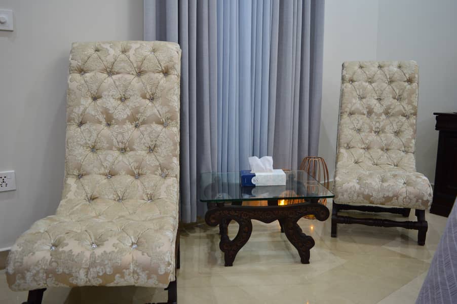 Tufted High-Back Chairs with Glass-Top Table. 0