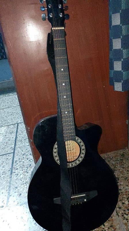 Black guitar good quality, open from down side and has 5 strings 3