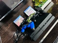 PS4 fat edition with controllers and games