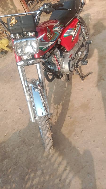 Honda 125 2023 model neet and clean condition Islamabad number 3 digit 4