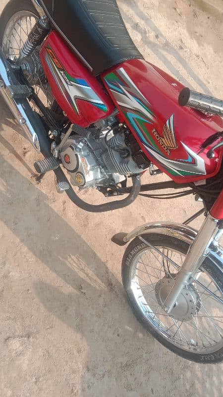 Honda 125 2023 model neet and clean condition Islamabad number 3 digit 10