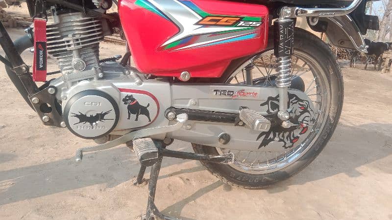 Honda 125 2023 model neet and clean condition Islamabad number 3 digit 13