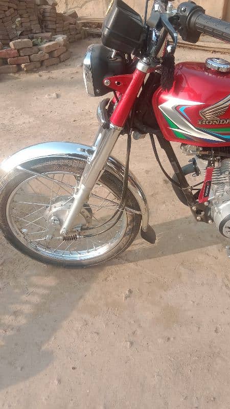 Honda 125 2023 model neet and clean condition Islamabad number 3 digit 14