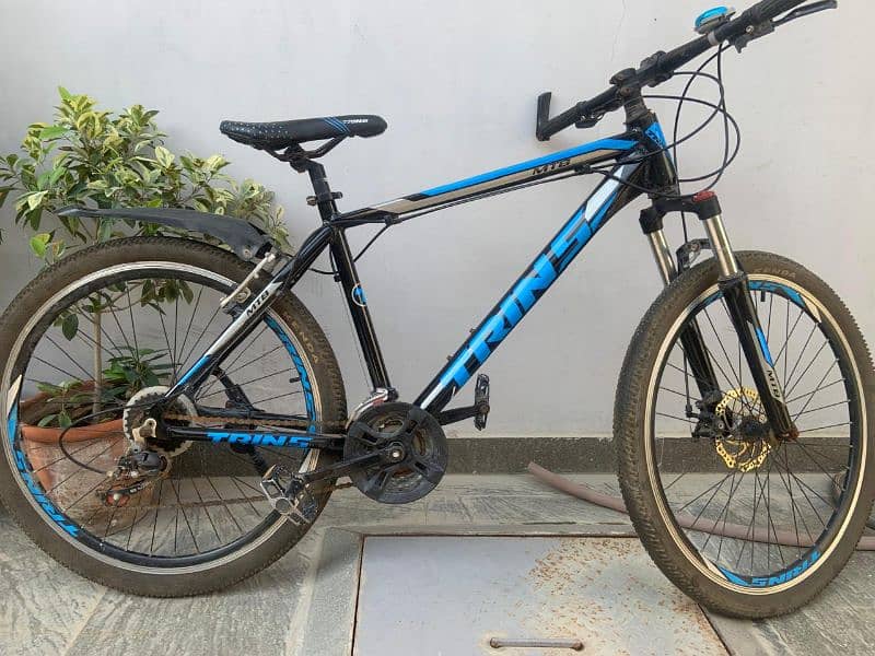 imported mountain bike with free brake light and seat cover. 0