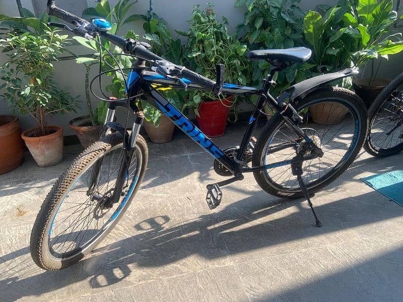 imported mountain bike with free brake light and seat cover. 1