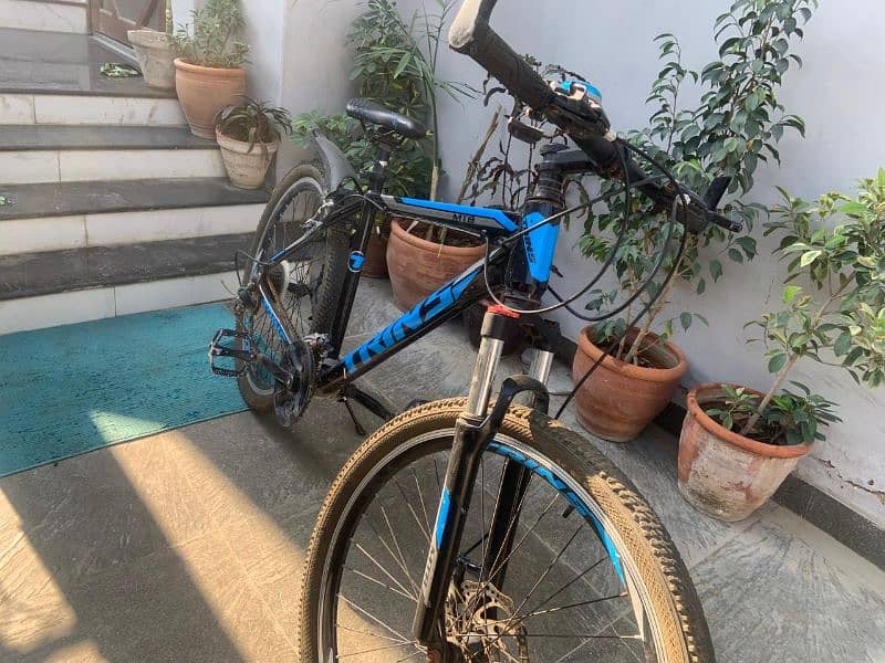 imported mountain bike with free brake light and seat cover. 2