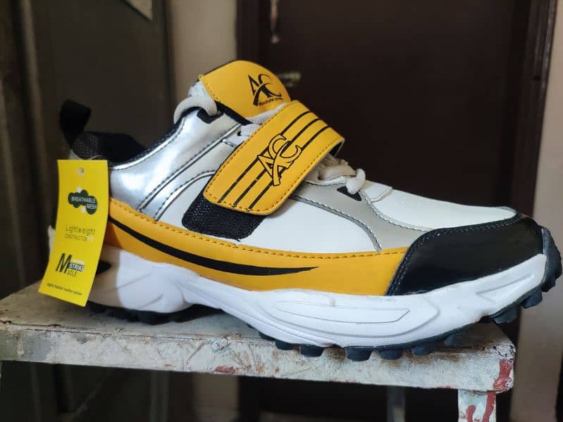 AC Cricket Shoes D1 Black Yellow 0