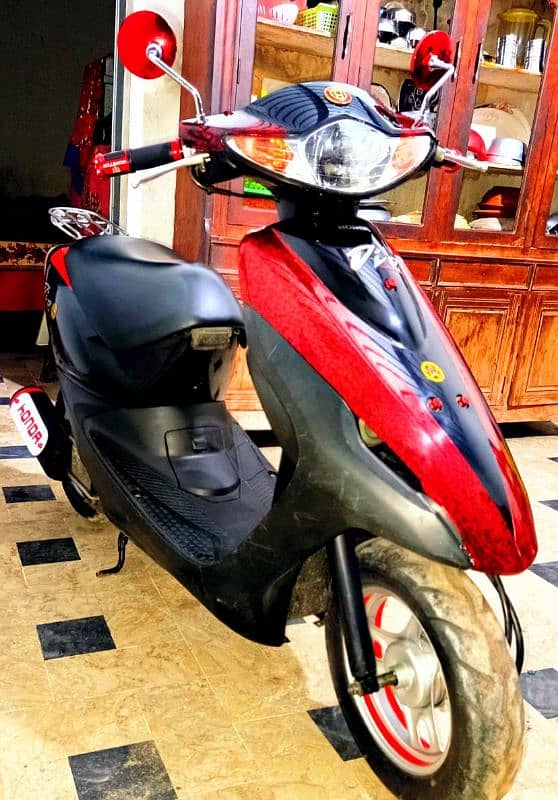 honda dio 100% ok red black 9