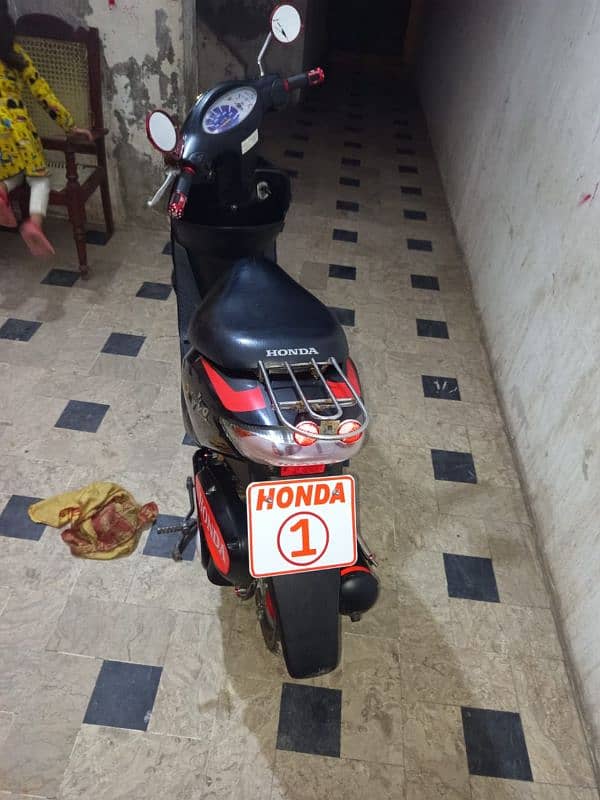 honda dio 100% ok red black 10