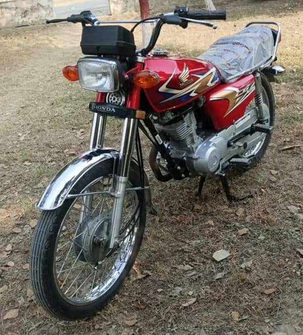 Honda 125 fast oner ha pindi number ha 0