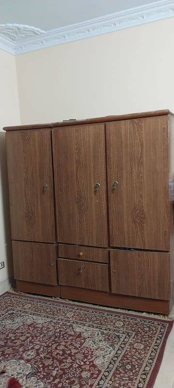 3-door wooden cupboard 0