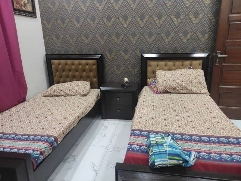 pair of single bed with side table 0