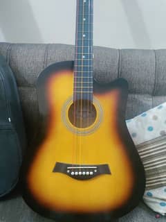 Acoustic guitar with bag and picks