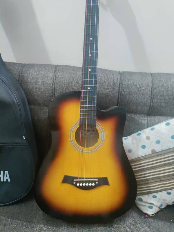 Acoustic guitar with bag and picks 1