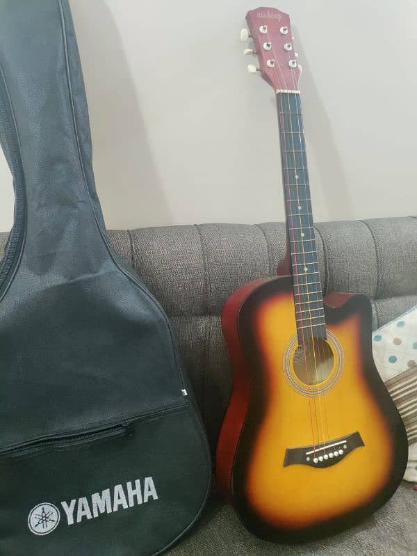 Acoustic guitar with bag and picks 3