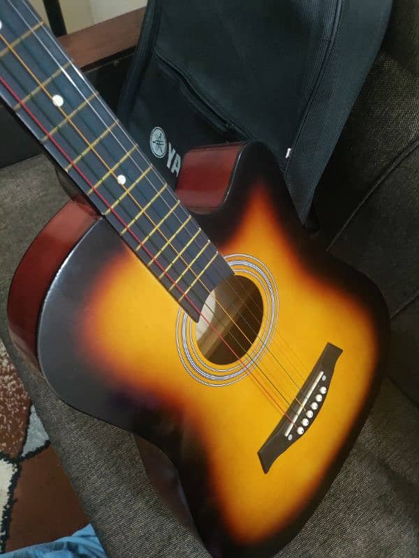 Acoustic guitar with bag and picks 9