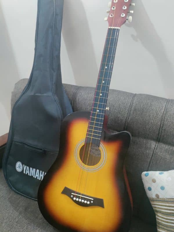 Acoustic guitar with bag and picks 10