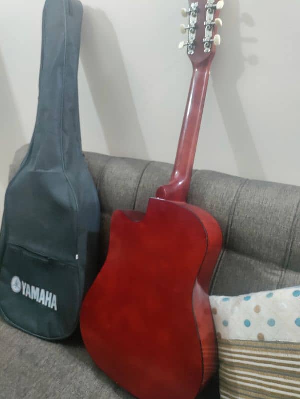 Acoustic guitar with bag and picks 11