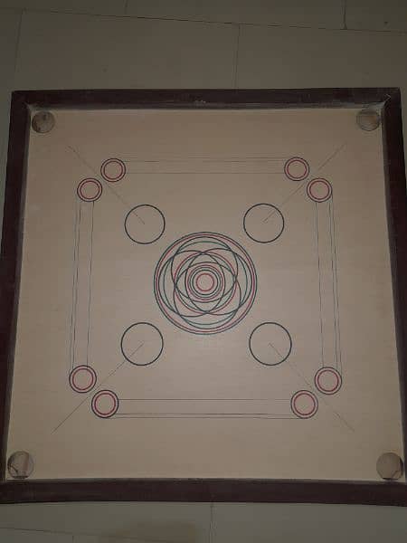 carrom with its all black,white and a red coin + stricker 3