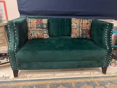 Two-seater velvet sofa